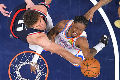 Oklahoma City Thunder guard Jalen Williams, right, shoots as Los Angeles Clippers center Brook Lopez defends during the second half of an NBA basketball game Wednesday, April 8, 2026, in Inglewood, Calif. ()
