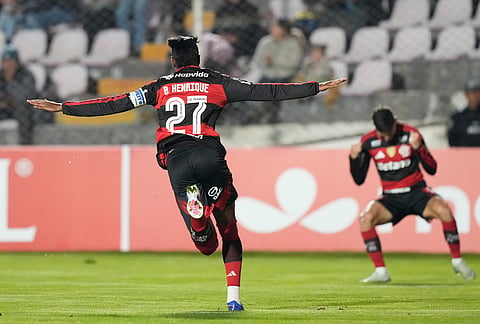 Bruno Henrique of Brazil's Flamengo, left, celebrates scoring his side's opening goal against Peru's Cusco FC during a Copa Libertadores Group A soccer match in Cuzco, Peru.