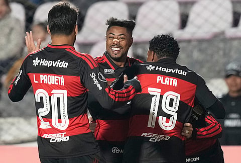 Bruno Henrique of Brazil's Flamengo, center, celebrates with teammates after scoring his side's opening goal against Peru's Cusco FC during a Copa Libertadores Group A soccer match in Cuzco, Peru.