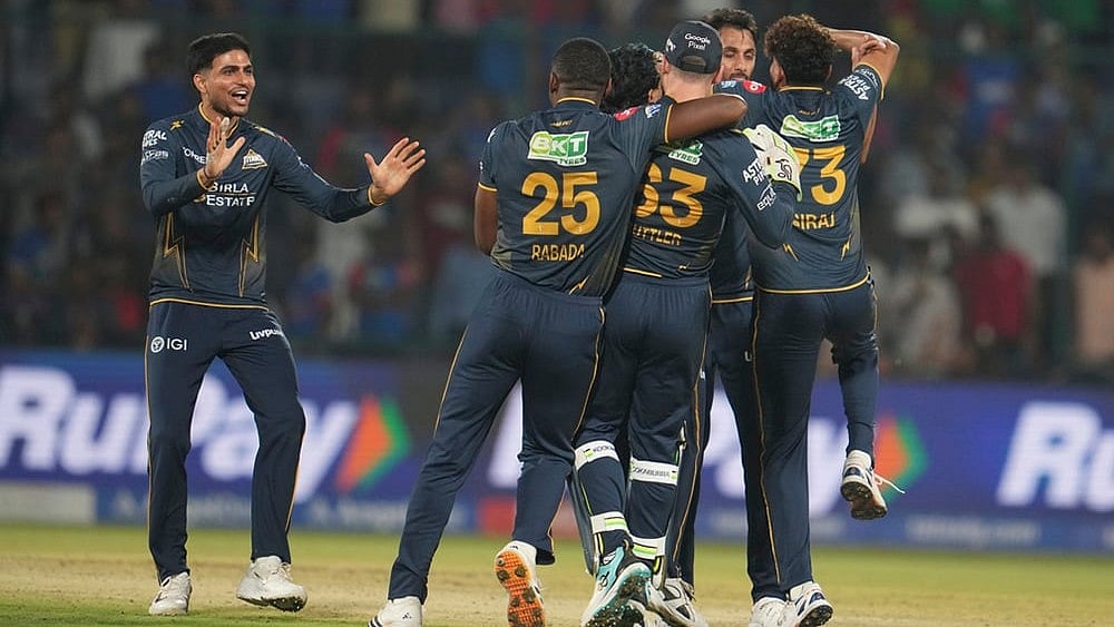 Gujarat Titans' captain Shubman Gill, left, along with his teammates celebrates after they won the Indian Premier League cricket match against Delhi Capitals in New Delhi. - | Photo: AP/Manish Swarup