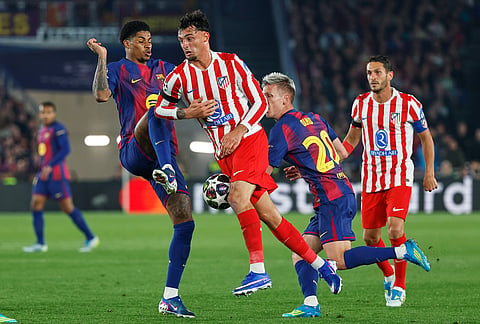 Barcelona's Marcus Rashford, left, challenges for the ball with Atletico Madrid's Julian Alvarez during the Champions League quarterfinal first leg soccer match between Barcelona and Atletico Madrid in Barcelona, Spain.