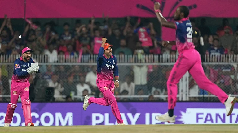 Rajasthan Royals' Jofra Archer, right, and others celebrates the wicket of Royal Challengers Bengaluru's Phil Salt during their Indian Premier League match in Guwahati. - AP/Anupam Nath