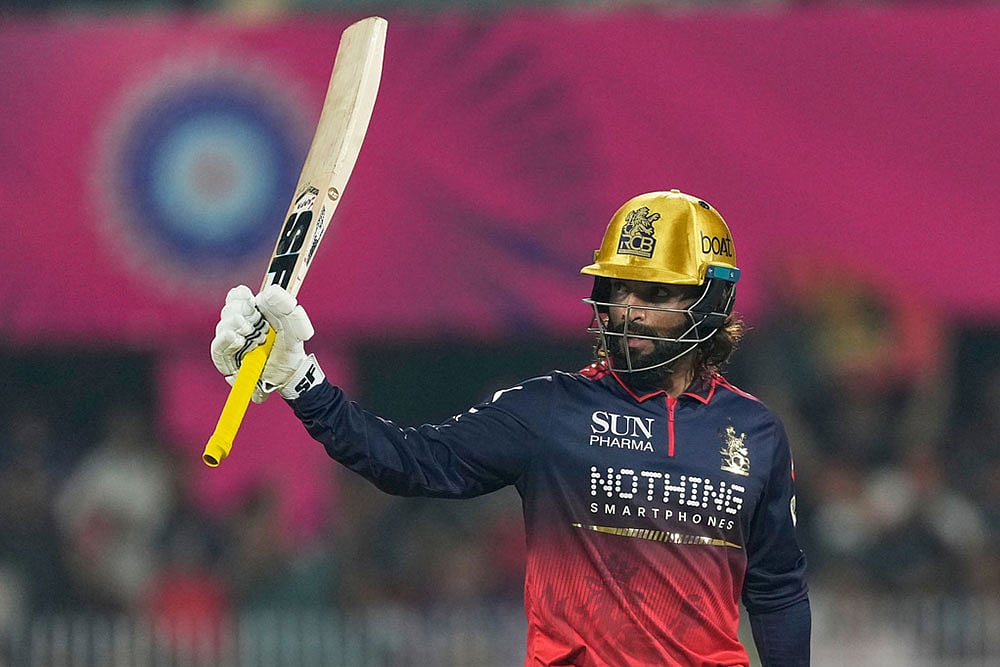 Royal Challengers Bengalurus captain Rajat Patidar celebrates his fifty runs