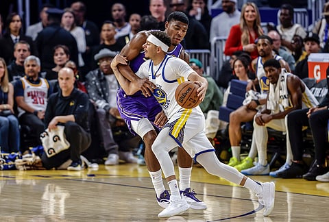 Seth Curry (31) drives to the basket defended by Rui Hachimura (28) in the first half as the Golden State Warriors played the Los Angeles Lakers in San Francisco.
