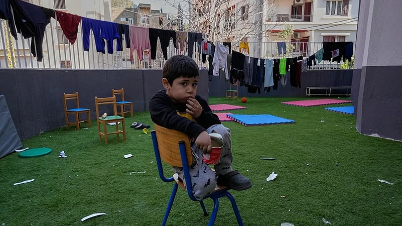 A displaced boy who fled Israeli strikes in southern Lebanon w