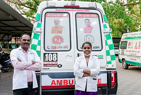 A doctor and technician stand with an ambulance as part of strengthened emergency healthcare services with the rollout of 375 new ambulances, including Basic Life Support, Advanced Life Support, and specialized neonatal units, in Chhattisgarh. 