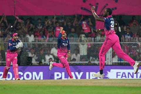 Rajasthan Royals' Jofra Archer, right, and others celebrates the wicket of Royal Challengers Bengaluru's Phil Salt during the Indian Premier League cricket match between Royal Challengers Bengaluru and Rajasthan Royals in Guwahati, India.