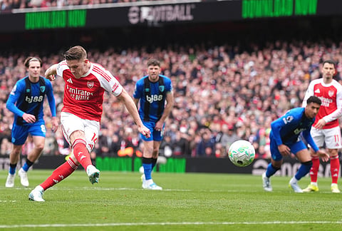 Arsenal's Viktor Gyokeres, left, scores their side's first goal of the game from the penalty spot during the English Premier League soccer match between Arsenal and Bournemouth, in London.