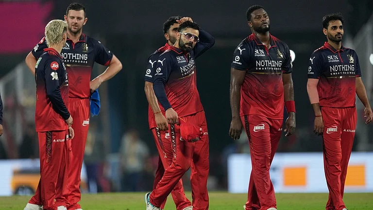 Royal Challengers Bengaluru's Virat Kohli and others leave the field after being defeated by the Rajasthan Royals during their Indian Premier League match in Guwahati. - AP/Anupam Nath