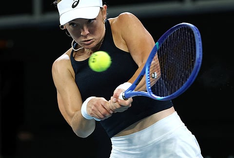 Britain's Katie Swan hits a backhand to Australia's Emerson Jones during their Billy Jean King Cup tennis match in Melbourne.