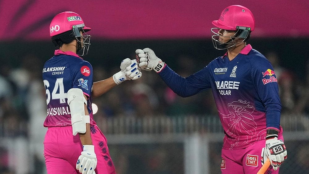 Rajasthan Royals' Vaibhav Sooryavanshi, right and Rajasthan Royals' Yashasvi Jaiswal toss during the Indian Premier League cricket match between Royal Challengers Bengaluru and Rajasthan Royals in Guwahati, India. - | Photo: AP/Anupam Nath