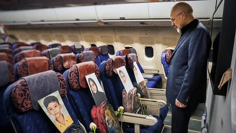 Photos and backpacks of primary school children from Minab, who were killed in US-Israeli strikes, can be seen on the seats of the airplane carrying Speaker of Iran’s Parliament Ghalibaf on his trip to Islamabad. - Source: X