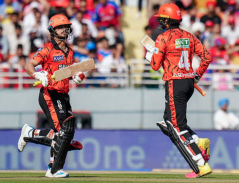 Sunrisers Hyderabad's captain Ishan Kishan, left, and Abhishek Sharma run between the wickets during the Indian Premier League (IPL) 2026 cricket match between Punjab Kings and Sunrisers Hyderabad, at MYS Cricket Stadium in Mullanpur, New Chandigarh.
