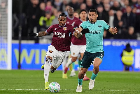West Ham United's Crysencio Summerville and Wolverhampton Wanderers' Andre battle for the ball during their English Premier League match in London.