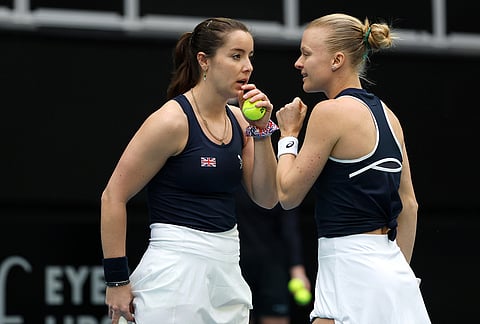 Britain's Harriet Dart and Jodie Burrage, right, talk while playing a doubles match against Australia in their Billy Jean King Cup tie in Melbourne.