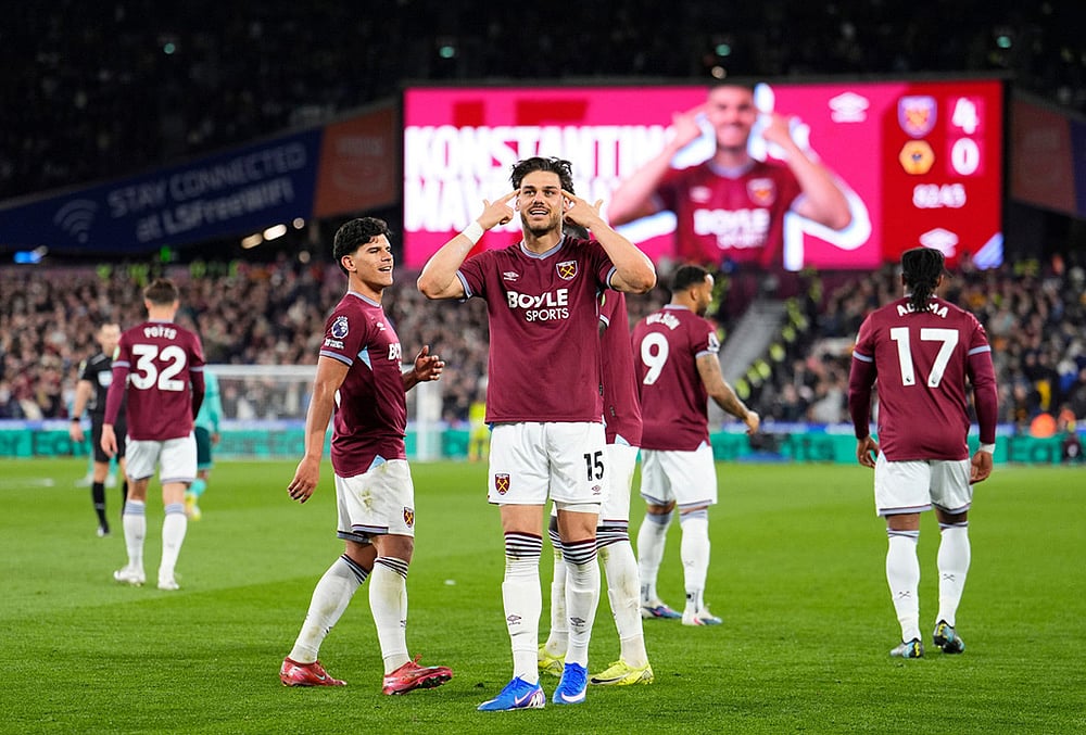 West Ham United's Konstantinos Mavropanos celebrates scoring their side's fourth goal of the game during their English Premier League soccer match against Wolverhampton Wanderers in London.
 - | Photo: Jordan Pettitt/PA via AP