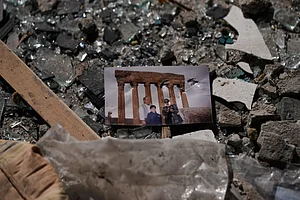 Hussein Malla : A family picture sits in the rubble at the site of a destroyed building that was hit a day ahead in an Israeli airstrike in central Beirut, Lebanon