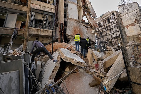 People inspect the rubble of a building destroyed in an Israeli airstrike a day earlier in Beirut, Lebanon