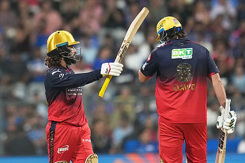 Royal Challengers Bengaluru's captain Rajat Patidar celebrates his fifty runs during the Indian Premier League cricket match between Mumbai Indians and Royal Challengers Bengaluru, in Mumbai , India.