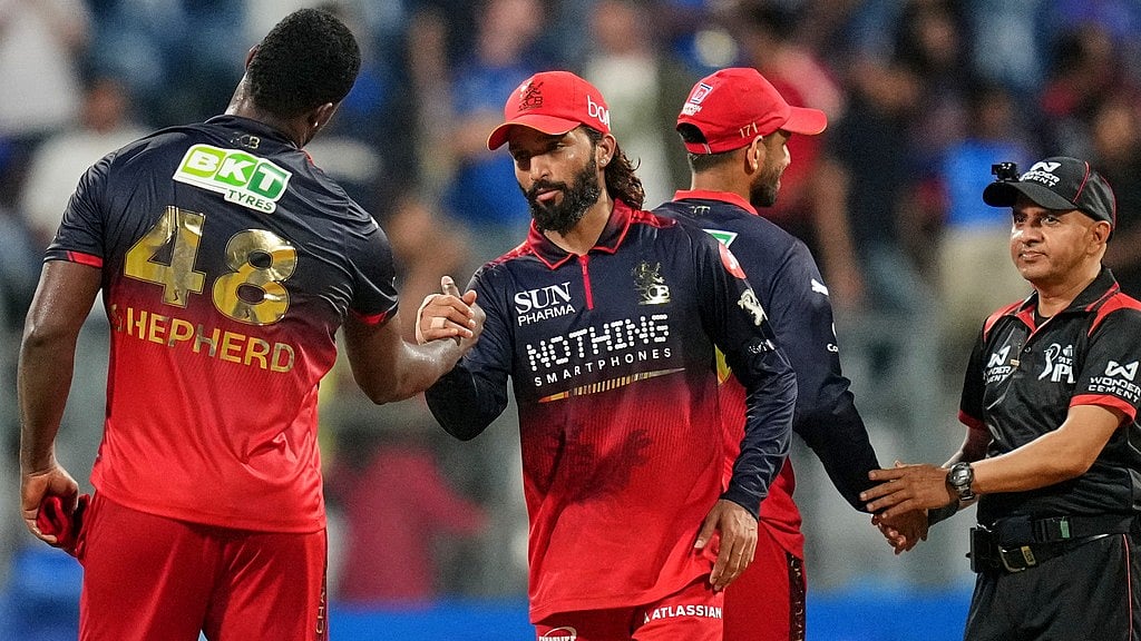 AP Photo/Rafiq Maqbool : Royal Challengers Bengaluru's Devdutt Padikkal with teammates celebrate the win over Royal Challengers Bengaluru during the Indian Premier League cricket match, in Mumbai , India, Sunday, April 12, 2026.