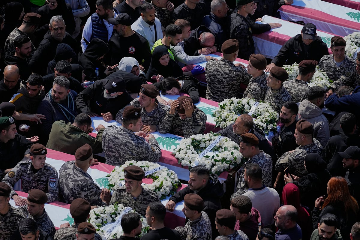 Colleagues mourn over the coffins during the funeral of 13 state security officers killed the previous day in an Israeli strike in the Lebanese coastal city of Sidon, Saturday, April 11, 2026. - (AP Photo/Mohammed Zaatari)
Source: AP