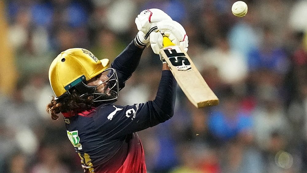 Royal Challengers Bengaluru's captain Rajat Patidar plays a shot during the Indian Premier League cricket match between Mumbai Indians and Royal Challengers Bengaluru, in Mumbai, India. - | Photo: AP/Rafiq Maqbool