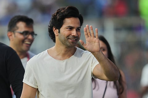 Bollywood actor Varun Dhawan arrives top watch the the Indian Premier League cricket match between Mumbai Indians and Royal Challengers Bengaluru, in Mumbai, India.