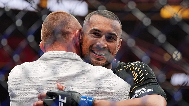 Carlos Ulberg, of New Zealand, reacts after defeating Jiri Prochazka, of Czechia, by TKO to win their light heavyweight title bout at a UFC 327 mixed martial arts event, Saturday, April 11, 2026, in Miami. - (AP Photo/Rebecca Blackwell)