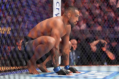 Carlos Ulberg, of New Zealand, prepares for the start of his light heavyweight title bout against Jiri Prochazka, of Czechia, at a UFC 327 mixed martial arts event in Miami.