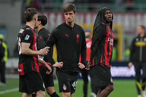 AC Milan players walk off thne pitch after the Serie A soccer match between AC Milan and Udinese, in Milan, Italy