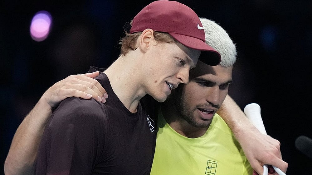 Italy's Jannik Sinner, left, and Spain's Carlos Alcaraz hug after the final tennis match of the ATP World Tour Finals, in Turin, Italy. - | Photo: AP/Antonio Calanni