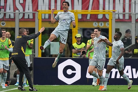 Udinese's Arthur Atta celebrates after scoring during the Serie A soccer match between AC Milan and Udinese, in Milan, Italy.