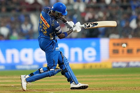 Mumbai Indians' captain Hardik Pandya plays a shot during the Indian Premier League cricket match between Mumbai Indians and Royal Challengers Bengaluru, in Mumbai, India.