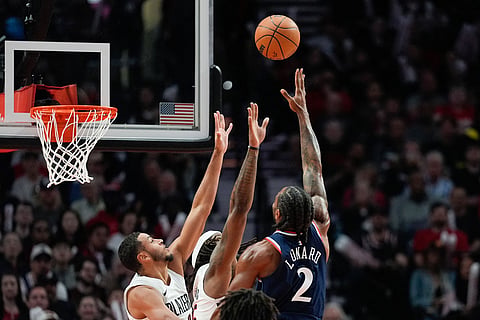 Los Angeles Clippers forward Kawhi Leonard (2) shoots during the first half of an NBA basketball game against the Portland Trail Blazers in Portland, Ore.