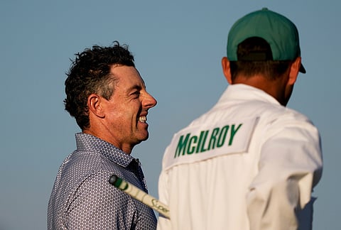 Rory McIlroy, of Northern Ireland, waits to play on the 18th hole during the third round of the Masters golf tournament at the Augusta National Golf Club, in Augusta, Georgia. 