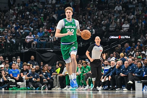 Dallas Mavericks' Cooper Flagg brings the ball up court during an NBA basketball game against the Chicago Bulls in Dallas.