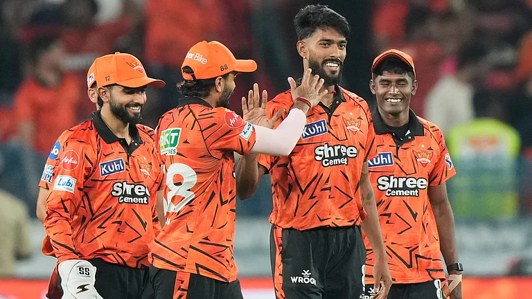 Praful Hinge, centre, celebrates the wicket of Rajasthan Royals' Vaibhav Sooryavanshi during the Indian Premier League cricket match. - AP
