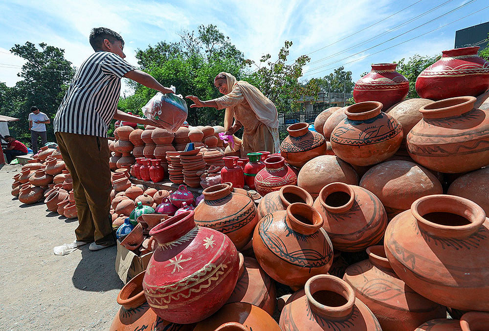 Jammu: Vendor sells earthen pots ahead of Baisakhi