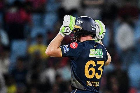 Gujarat Titans' Jos Buttler celebrates his fifty runs during the Indian Premier League cricket match between Gujarat Titans and Lucknow Super Giants in Lucknow, India.