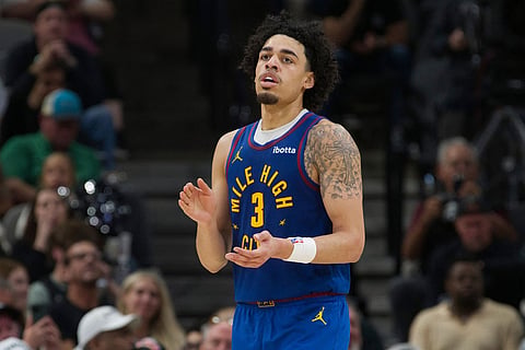 Denver Nuggets guard Julian Strawther celebrates a basket during the second half of an NBA basketball game against the San Antonio Spurs in San Antonio.