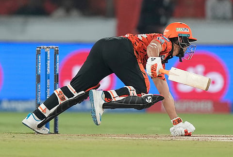 Sunrisers Hyderabad's captain Ishan Kishan loses his balance while playing a shot during the Indian Premier League cricket match between Sunrisers Hyderabad and Rajasthan Royals in Hyderabad.
