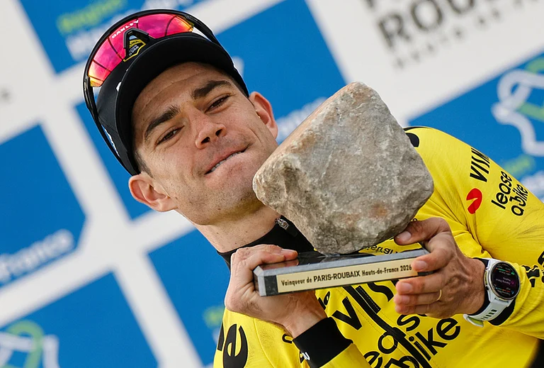 Belgium's Wout van Aert celebrates on the podium after winning the Paris-Roubaix cycling race in Roubaix, France. - | Photo: AP/Jean-Francois Badias