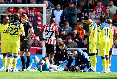 Tottenham Hotspur goalkeeper Antonin Kinsky receives treatment for an injury after colliding with team mate Cristian Romero, not pictured, during the Premier League soccer match between Sunderland and Tottenham Hotspur, in Sunderland, England.