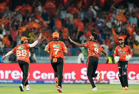 Sunrisers Hyderabad's Praful Hinge, second right, celebrates the wicket of Rajasthan Royals' captain Riyan Parag during the Indian Premier League cricket match between Sunrisers Hyderabad and Rajasthan Royals in Hyderabad.