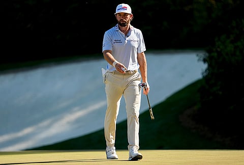 Cameron Young waves after his putt on the 13th hole during the third round of the Masters golf tournament at the Augusta National Golf Club, in Augusta, Georgia.