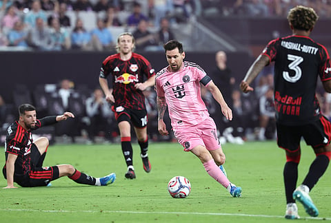 Inter Miami forward Lionel Messi, center right, attacks with the ball in the second half of an MLS soccer match against the New York Red Bulls, in Miami.