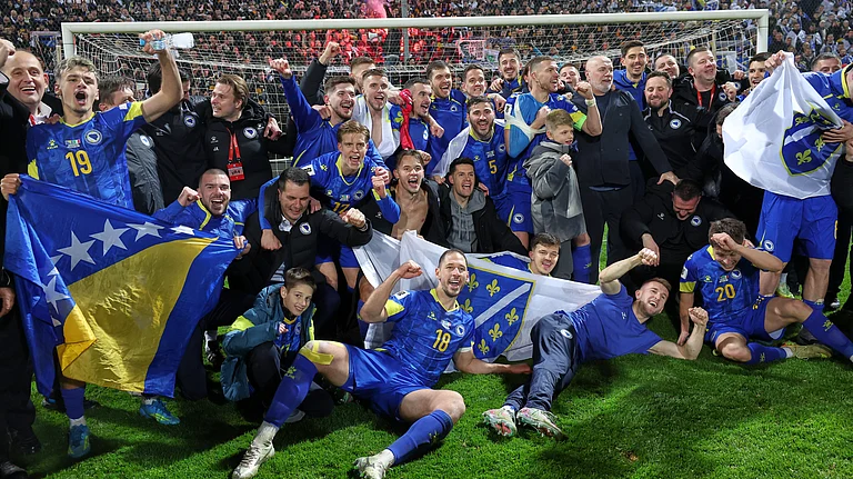 Bosnia players celebrate after winning a penalty shootout at the end of the World Cup qualifying playoff final soccer match between Bosnia and Italy in Zenica, Bosnia, Tuesday, March 31, 2026. - (AP Photo/Armin Durgut)