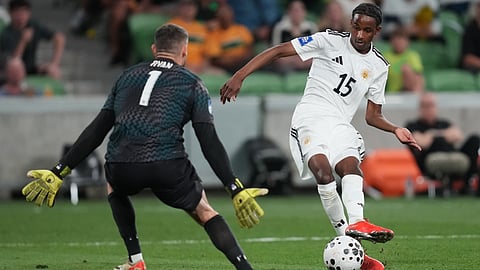 Curacao's Arany Martha, right, kicks the ball past Australia's goalkeeper Matthew Ryan to score his team's first goal during their international soccer friendly in Melbourne, Australia, Tuesday, March 31, 2026. 