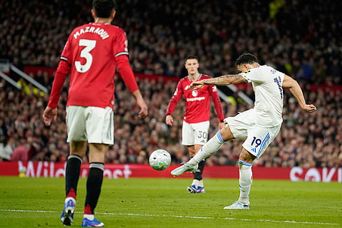 Leeds' Noah Okafor scores during the Premiier League soccer match between Manchester United and Leeds in Manchester, England.