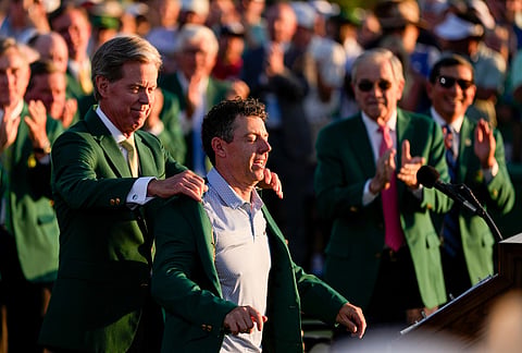 Augusta National Golf Club chairman Fred Ridley puts the green Jacket on Rory McIlroy, of Northern Ireland, after the Masters golf tournament at the Augusta National Golf Club in Augusta, Georgia.